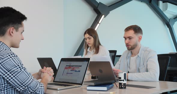 Young Entrepreneurs are Discussing a Financial Project alt