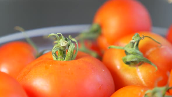 Tiny red cherry tomatoes in glass bowl slow panning 4K 3840X2160 UHD footage - Cherry red  tomatoes  alt