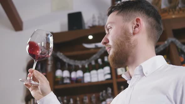 Sommelier Tating the Wine Slow Motion alt