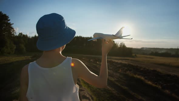 Funny Boy in a Blue Hat Playing with Airplane Near Wheat Field Boy Dreams of Being a Pilot