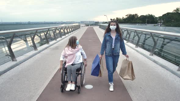 Masked Woman and Girl Walking After Shopping alt