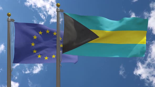European Union Flag Vs Bahamas Flag On Flagpole alt