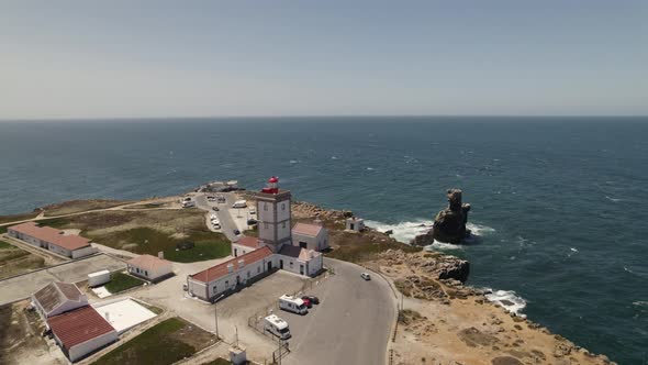 Aerial ascending view Cabo Carvoeiro lighthouse, Atlantic ocean Horizon, Peniche