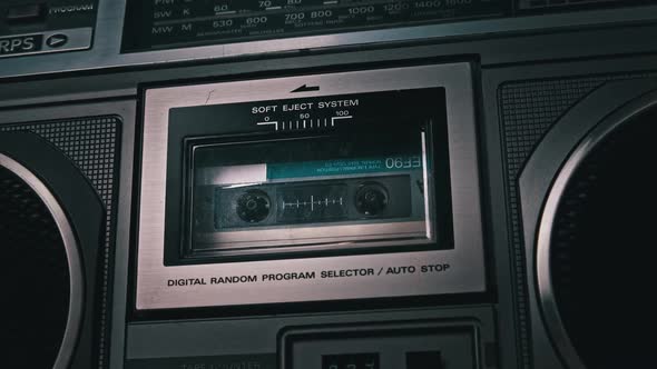 Audiocassette Rotates in Deck of an Old Tape Recorder alt