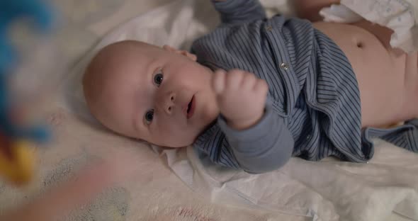 View of Funning Little Baby During the Massage Process alt