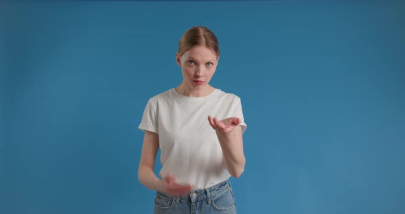 Hipster Female in Suit Rubbing Her Hands and Showing Money Gesture Smiling at Camera alt