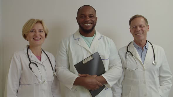 Portrait of Diverse Multiethnic Medical Colleagues Looking with Friendly Smiles at Hospital alt