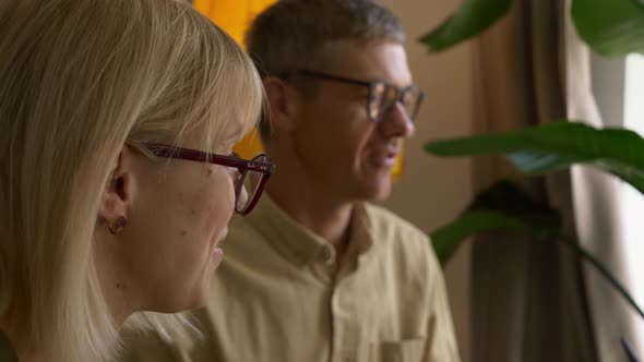 family having dinner at the table indoor at home alt