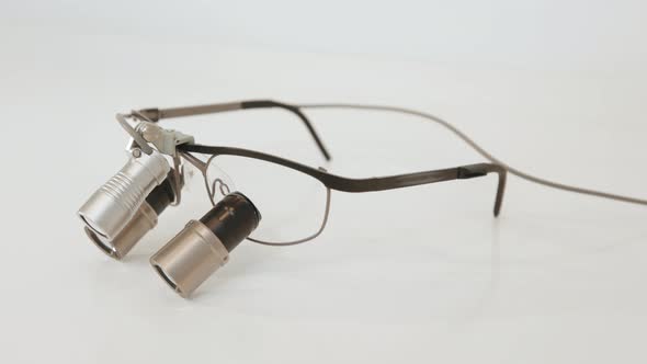 Spectacles Magnifying Binocular for Dental Surgery on the Table