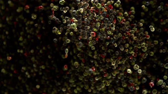 Super Slow Motion Shot of Color Pepper Explosion on Black Background at 1000Fps. alt