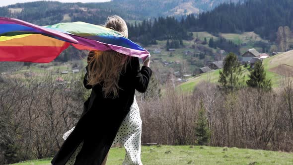 Transgender Holds the LGBT Flag on International Day alt