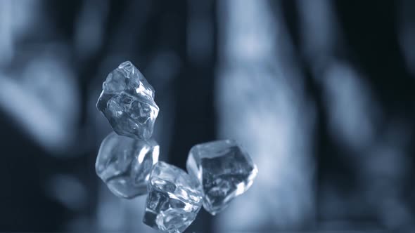 Cubes falling and bouncing on puddle, Slow Motion alt