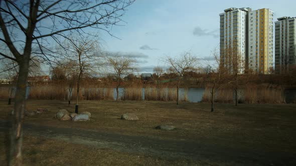 City block near the river. Multi-story houses. Water city system. Aerial photography. alt