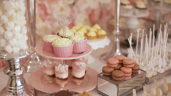 Cute Candy Bar with Various Cakes and Candies. Wedding Candybar. alt