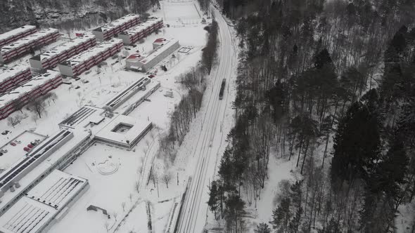 Trolley Tram Line in Rural Town Winter Landscape Aerial Reveal
