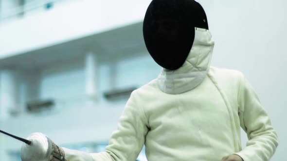 Fencing. Fencer During a Duel. Slow Motion. Kyiv. Ukraine alt