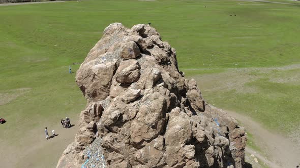 Tourists Religious Symbol Taikhar Chuluu Rock in Arkhangai Aimag, Mongolia alt
