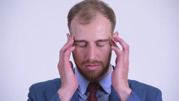 Face of Stressed Bearded Businessman Having Headache