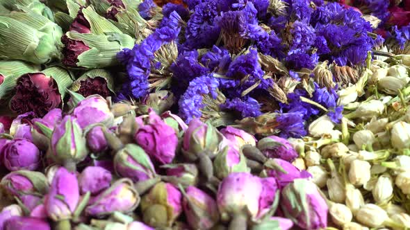 Flower teas on a wooden board alt