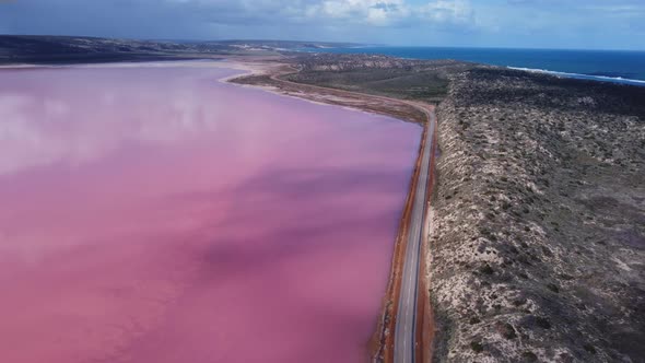 Aerial View Flying Forward to the South of the Pink Water of Hutt Lagoon alt