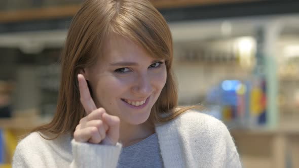 Positive Excited Woman Pointing at Camera in Cafe, Thumbs Up alt
