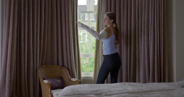 Woman wearing top in bedroom