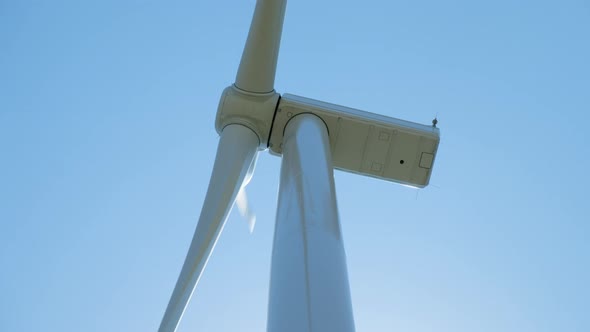 Wind Generator with Rotating Blades Against Clear Sky