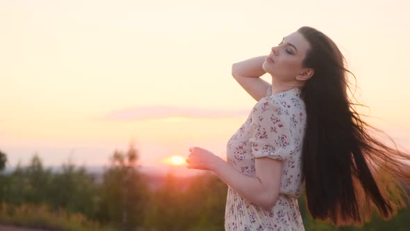 Portrait of Attractive Woman in Nature at Sunrise or Sunset Sun Shine in Camera alt