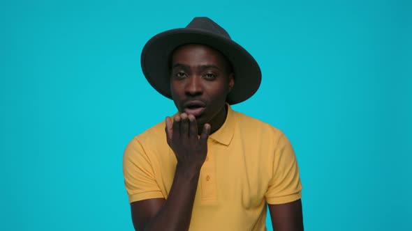 Happy African Guy Sending Air Kiss for Expressing Love alt