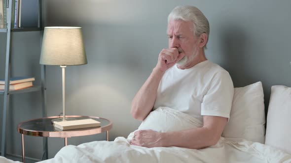 Sick Old Man Coughing in Bed  alt
