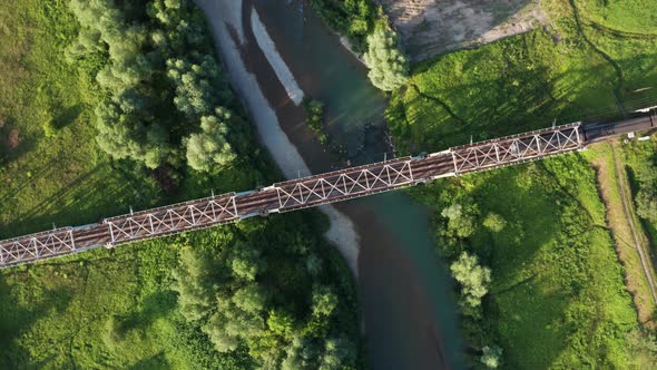 Train Moving on Bridge Above a River