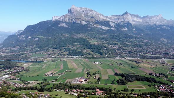 Flying along a large valley in the french Alps. Arve valley. alt