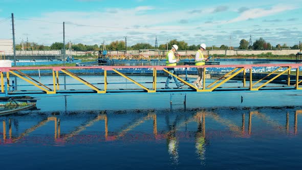 Drone Shot of Wastewater Operators Examining a Water Clarifier alt