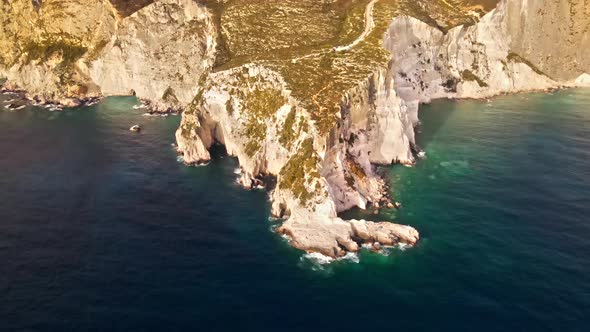 Aerial drone view of the Ionian Sea coast of Zakynthos, Greece. Rocky ridge, sparce vegetation alt