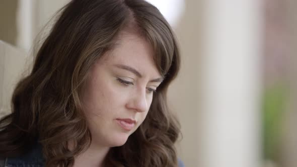 Young woman answering phone call alt