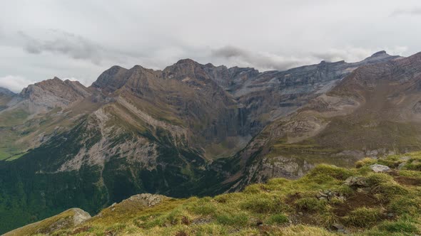timelapse of cloud motion over Cirque de Gavarnie with waterfall at pyrenees mountains, France alt
