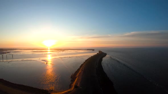 From the ground to the sky by the ocean at the sunrise drone aerial footage birds eye view alt