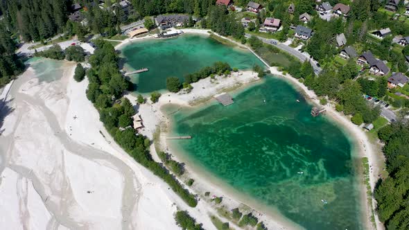 Aerial footage of a beautiful lake with turquoise water, side view of Jasna lake alt