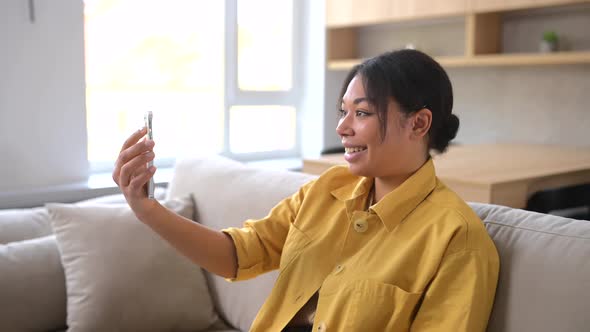 Glad Multiracial Woman Lady Talking Online on Mobile Phone Via Video Connection