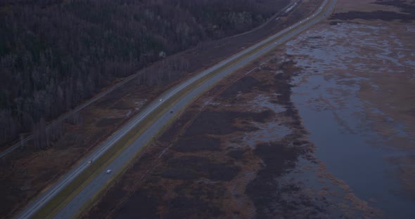 Aerial helicopter flyover of a city by the bay, circling back and forth around skyscrapers, towers,  alt