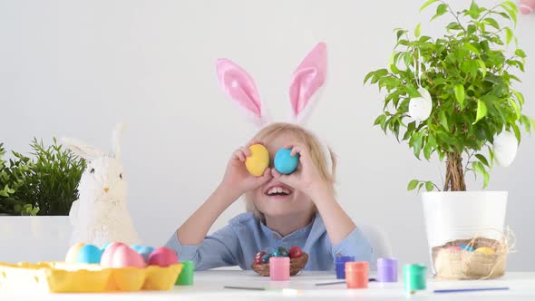 Glad child celebrate Easter at home or in kindergarten or school