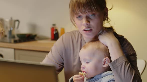 Mom Using Laptop and Talking with Kids at Home alt