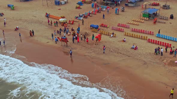 Aerial view of a crowded beach in India, Puri, Orissa. 4k alt