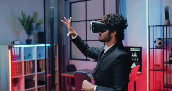 Muslim Office Worker Working on Virtual Screen in Special 3d Glasses in Workroom alt