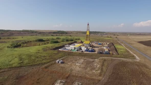 Oil and Natural Gas Production, Aerial View of Well in Field in Summer Day