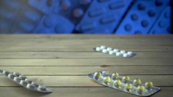 Closeup Shot of Different Pills Falling on Table, Pharmaceutical Industry Concept.