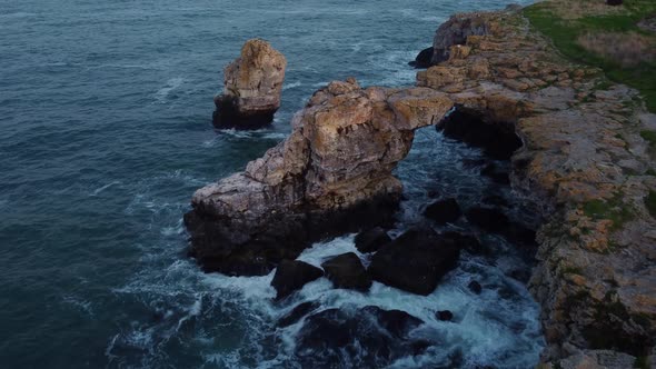Aerial View of Sea Waves and Fantastic Cliffs Rocky Coast alt