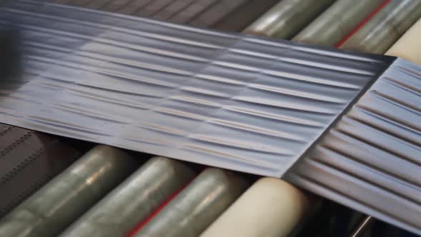 Rubber Tape on a Large Tire Factory Close-up alt