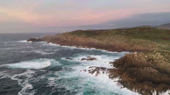 Amazing drone aerial sea landscape view of Cape Tourinan Lighthouse, in Spain alt