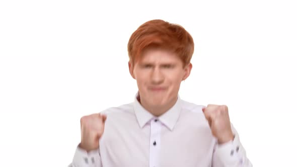 Ginger Caucasian Attractive Young Man Rejoicing Looking at Camera on White Background alt